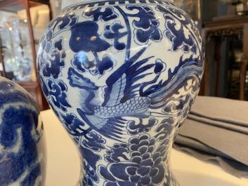 Three Chinese blue and white vases and a monochrome red vase, 19th C.