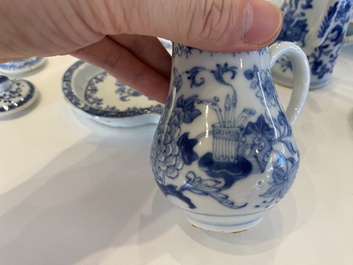 A rare Chinese blue and white set of two jugs and two casters on stand, Qianlong