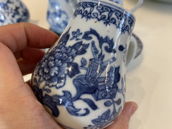 A rare Chinese blue and white set of two jugs and two casters on stand, Qianlong