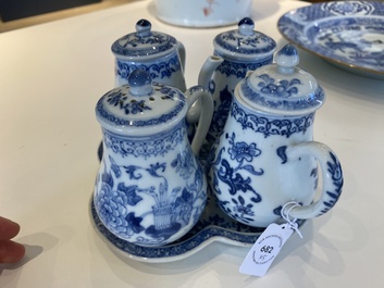 A rare Chinese blue and white set of two jugs and two casters on stand, Qianlong