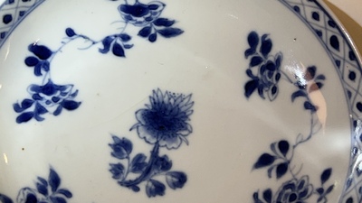 A pair of Chinese blue and white cups and saucers, Chenghua mark, Kangxi