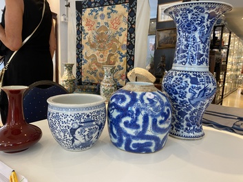 Three Chinese blue and white vases and a monochrome red vase, 19th C.