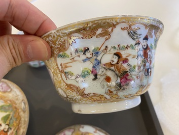 A Chinese famille rose covered bowl, a saucer and two cups with a hunting scene, Qianlong