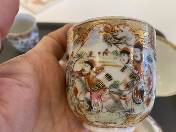 A Chinese famille rose covered bowl, a saucer and two cups with a hunting scene, Qianlong