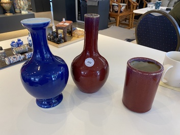 Two Chinese monochrome sang-de-boeuf and powder-blue-glazed vases and a brush pot, 18/19th C.