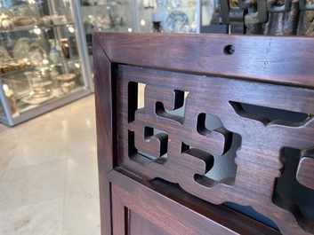 A Chinese wooden mirror and a foldable stool, 19/20th C.