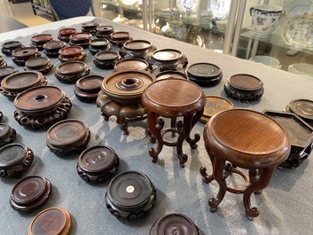 71 Chinese well-carved wooden stands, 19/20th C.
