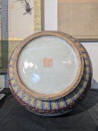 A Chinese famille rose 'hu' vase and a pair of fish bowls, 20th C.