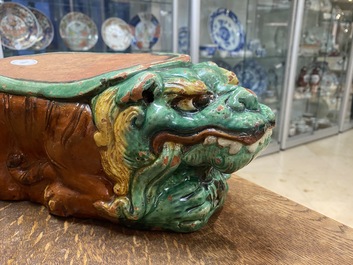 A Chinese sancai-glazed 'three lions' pillow or neck rest, Ming