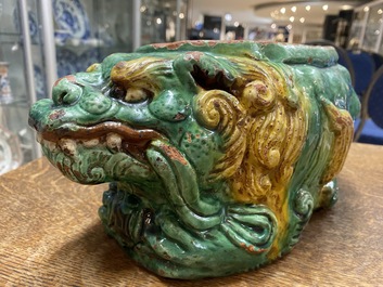 A Chinese sancai-glazed 'three lions' pillow or neck rest, Ming