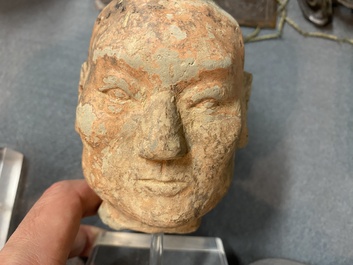 Eight various carved stone heads, incl. Chinese, Etruscan, Gandhara and Japanese
