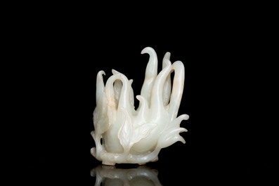 A fine Chinese white jade carving of a Buddha's hand on wooden stand, Qing