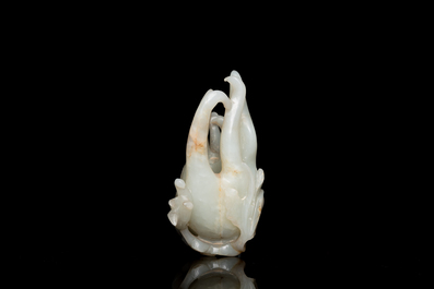 A fine Chinese white jade carving of a Buddha's hand on wooden stand, Qing