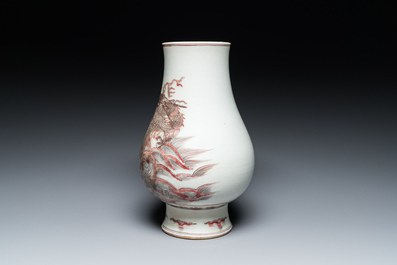 A Chinese copper-red 'dragon and carp' vase, Kangxi mark, 20th C.