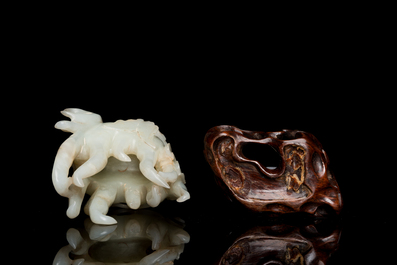 A fine Chinese white jade carving of a Buddha's hand on wooden stand, Qing