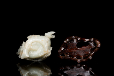 A fine Chinese white jade carving of a Buddha's hand on wooden stand, Qing