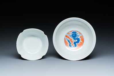 A Chinese blue, white and iron-red 'dragon' bowl and a famille rose 'immortals' bowl, Jiaqing and Wanli mark, 19th C.