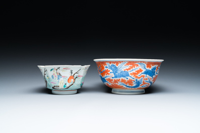 A Chinese blue, white and iron-red 'dragon' bowl and a famille rose 'immortals' bowl, Jiaqing and Wanli mark, 19th C.