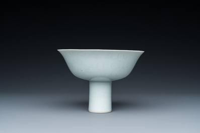 A Chinese monochrome white-glazed stem cup with anhua dragon design, Qianlong mark, 18/19th C.