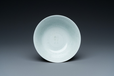 A Chinese monochrome white-glazed stem cup with anhua dragon design, Qianlong mark, 18/19th C.