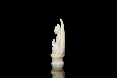 A Chinese white jade sculpture of Guanyin on a lotus throne, Qing