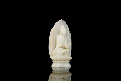 A Chinese white jade sculpture of Guanyin on a lotus throne, Qing