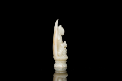 A Chinese white jade sculpture of Guanyin on a lotus throne, Qing