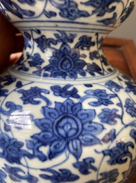 A Chinese blue and white 'lotus scroll' double gourd vase, Jiajing/Wanli