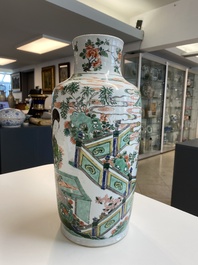 A Chinese famille verte rouleau vase with ladies at a scholar's table, Kangxi