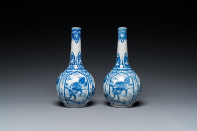 A pair of Chinese blue and white bottle vases with mythical animals, 19th C.