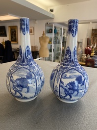 A pair of Chinese blue and white bottle vases with mythical animals, 19th C.