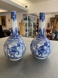 A pair of Chinese blue and white bottle vases with mythical animals, 19th C.