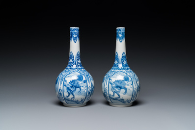 A pair of Chinese blue and white bottle vases with mythical animals, 19th C.