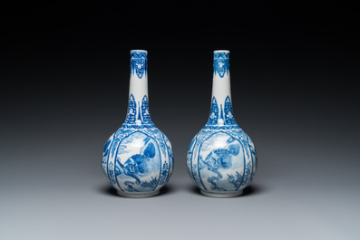 A pair of Chinese blue and white bottle vases with mythical animals, 19th C.