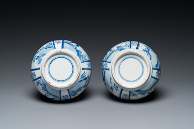 A pair of Chinese blue and white bottle vases with mythical animals, 19th C.