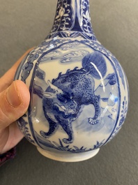 A pair of Chinese blue and white bottle vases with mythical animals, 19th C.