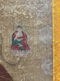 Ecole chinoise: 'Bouddha debout sur deux fleurs de lotus', encre et couleurs sur soie, 18/19&egrave;me