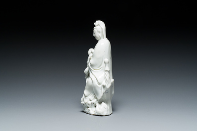 A Chinese Dehua blanc de Chine figure of Guanyin with a boy, Kangxi/Qianlong