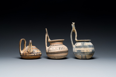 Two geometrical decorated Daunian pottery vessels and an olive press, Southern Italy, 6th/3rd C. b.C.