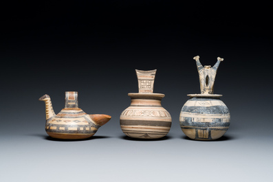 Two geometrical decorated Daunian pottery vessels and an olive press, Southern Italy, 6th/3rd C. b.C.