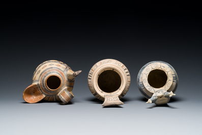 Two geometrical decorated Daunian pottery vessels and an olive press, Southern Italy, 6th/3rd C. b.C.