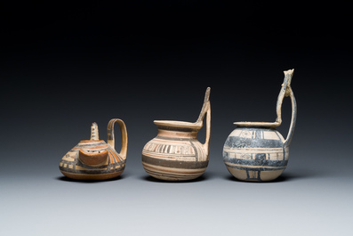 Two geometrical decorated Daunian pottery vessels and an olive press, Southern Italy, 6th/3rd C. b.C.