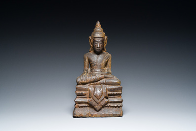 A Burmese partly gilt and lacquered teak wooden Buddha, Hanthawaddy Kingdom, 16th C.