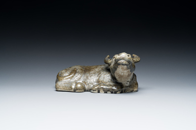 A Chinese monochrome brown-grey-glazed sculpture of a reclining water buffalo on wooden stand, 19th C.