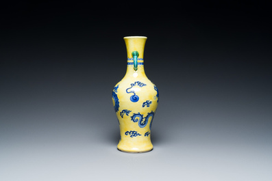 A Chinese blue and white yellow-ground 'dragon' vase with green-glazed handles on a jade-inset wooden stand, Jiaqing mark, 19/20th C.