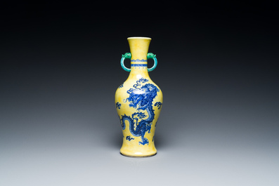 A Chinese blue and white yellow-ground 'dragon' vase with green-glazed handles on a jade-inset wooden stand, Jiaqing mark, 19/20th C.