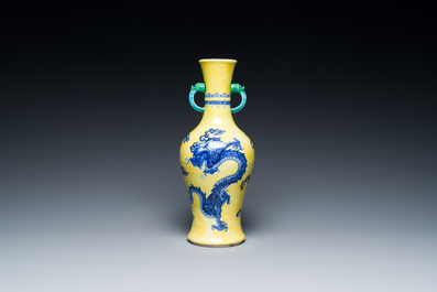 A Chinese blue and white yellow-ground 'dragon' vase with green-glazed handles on a jade-inset wooden stand, Jiaqing mark, 19/20th C.