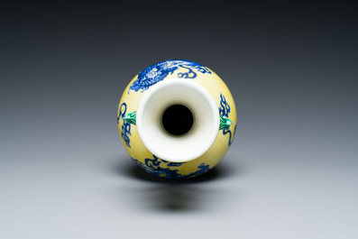 A Chinese blue and white yellow-ground 'dragon' vase with green-glazed handles on a jade-inset wooden stand, Jiaqing mark, 19/20th C.