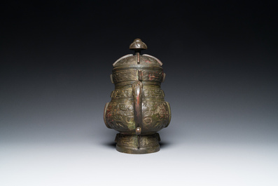 A Chinese archaic bronze ritual wine vessel and cover in Western Zhou-style, 'you', Ming