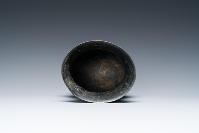 A Chinese inscribed archaic bronze ritual wine vessel, 'zhi', late Shang dynasty